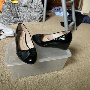 glossy black wedge heel